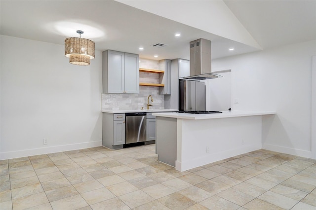 kitchen with island exhaust hood, hanging light fixtures, kitchen peninsula, stainless steel dishwasher, and gray cabinetry