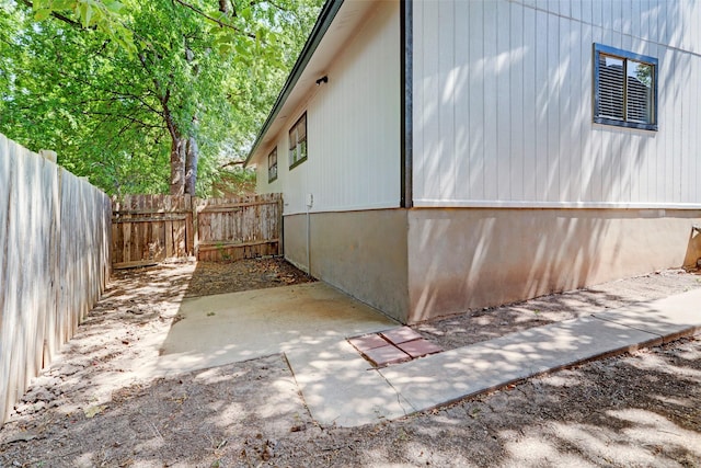 view of side of property featuring a patio