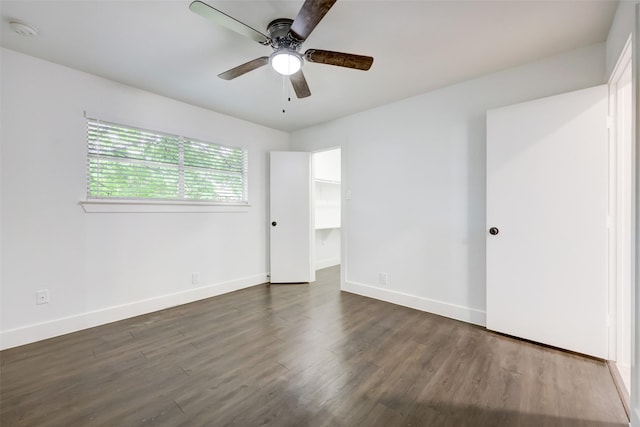 unfurnished room featuring ceiling fan and dark hardwood / wood-style floors