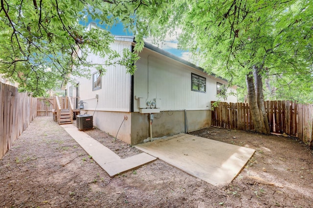 view of home's exterior featuring central AC and a patio area