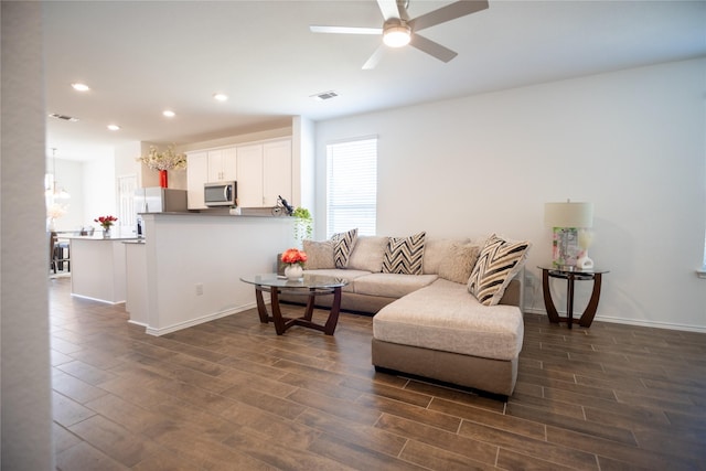 living area with visible vents, recessed lighting, dark wood-type flooring, and ceiling fan