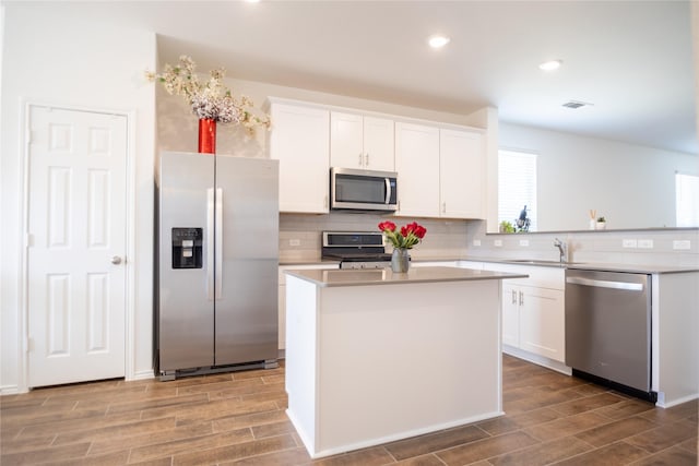 kitchen featuring white cabinets, appliances with stainless steel finishes, and a kitchen island