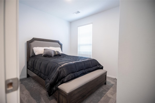 bedroom featuring dark colored carpet