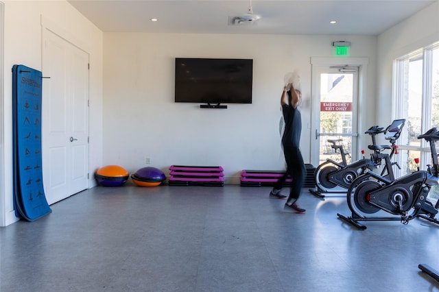 workout area with tile patterned floors and recessed lighting