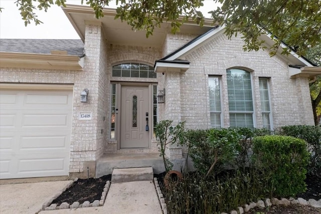 doorway to property featuring a garage