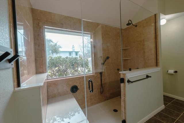 bathroom with tile patterned floors and a shower with shower door