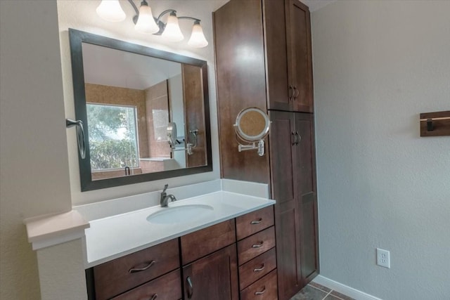 bathroom featuring tile patterned flooring and vanity