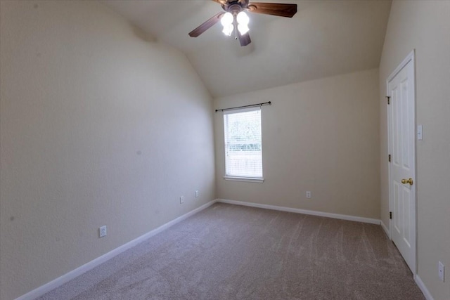 unfurnished room with vaulted ceiling, carpet floors, and ceiling fan