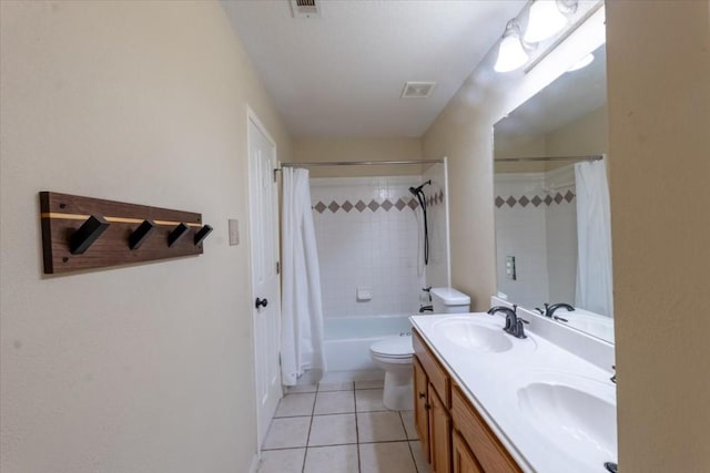 full bathroom featuring tile patterned flooring, shower / bath combo, vanity, and toilet