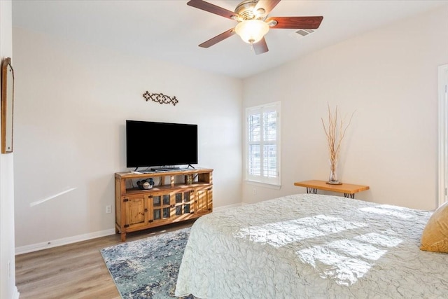 bedroom featuring ceiling fan and wood-type flooring