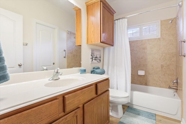 full bathroom with toilet, hardwood / wood-style floors, vanity, and shower / bath combo with shower curtain