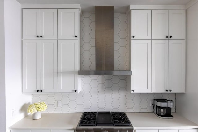 4007 Emory Peak Pass, Austin, TX 78731 - kitchen featuring wall chimney range hood, light countertops, white cabinets, and stove