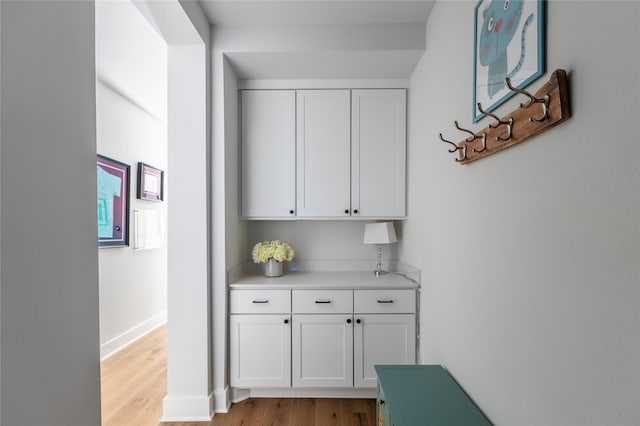 hallway featuring light hardwood / wood-style flooring