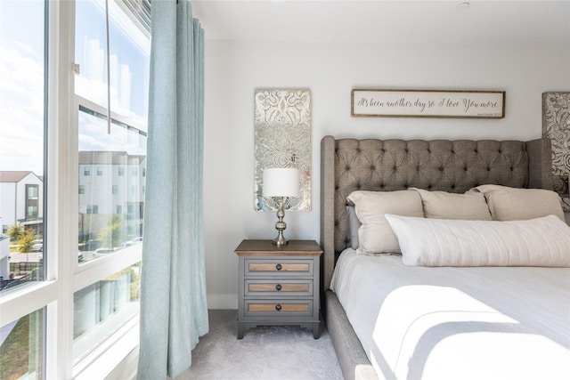 bedroom with light colored carpet