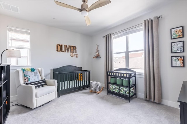 4007 Emory Peak Pass, Austin, TX 78731 - carpeted bedroom featuring ceiling fan, a nursery area, and baseboards