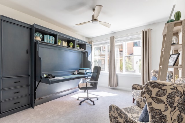 home office featuring ceiling fan and light colored carpet