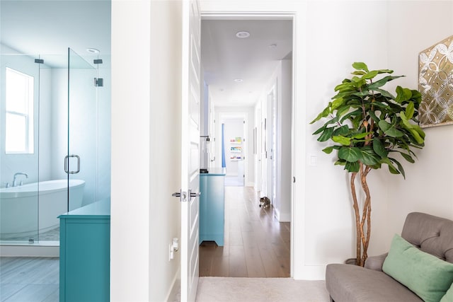 hallway with wood finished floors