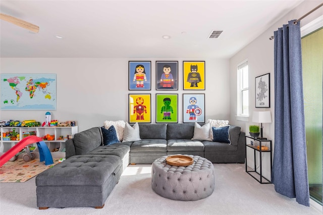 living room with carpet floors and visible vents