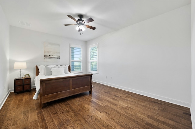 bedroom featuring ceiling fan and dark hardwood / wood-style floors