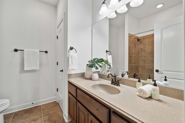 bathroom featuring vanity, toilet, and tile patterned flooring