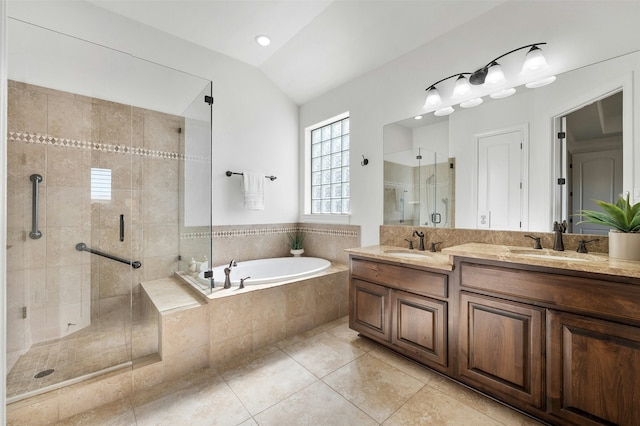 bathroom with independent shower and bath, tile patterned flooring, vaulted ceiling, and vanity