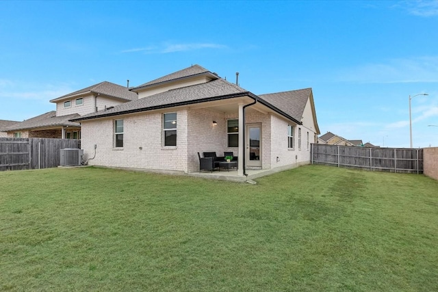 14117 Mcarthur Dr, Manor, TX 78653 - rear view of house with central AC, brick siding, a patio, and roof with shingles