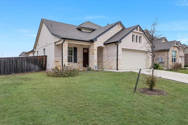 view of front of home featuring a garage and a front lawn