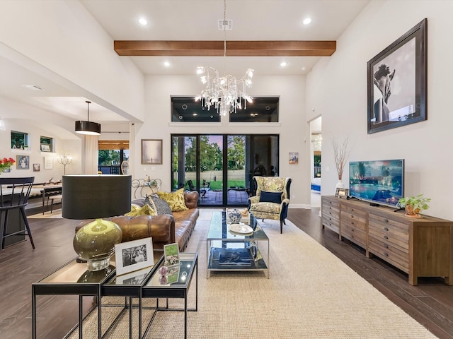 living room featuring beamed ceiling, plenty of natural light, dark wood-type flooring, and an inviting chandelier