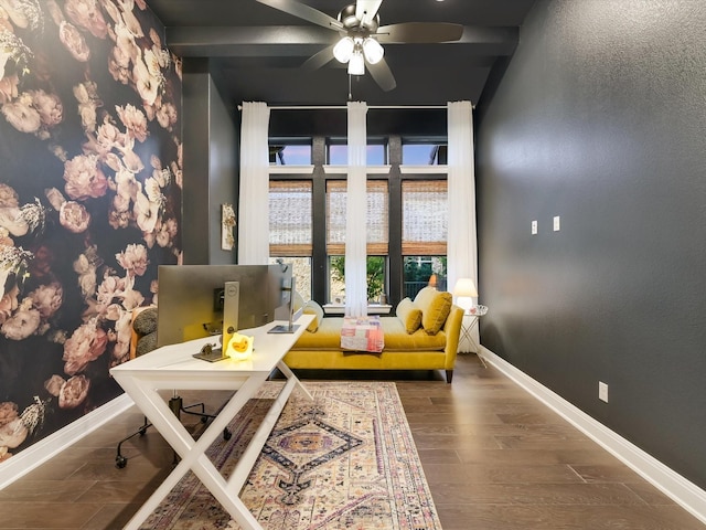 living area featuring dark hardwood / wood-style flooring and ceiling fan