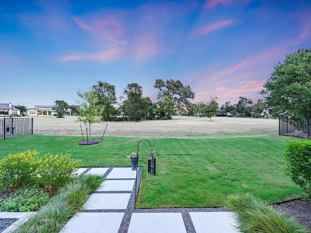 view of yard at dusk