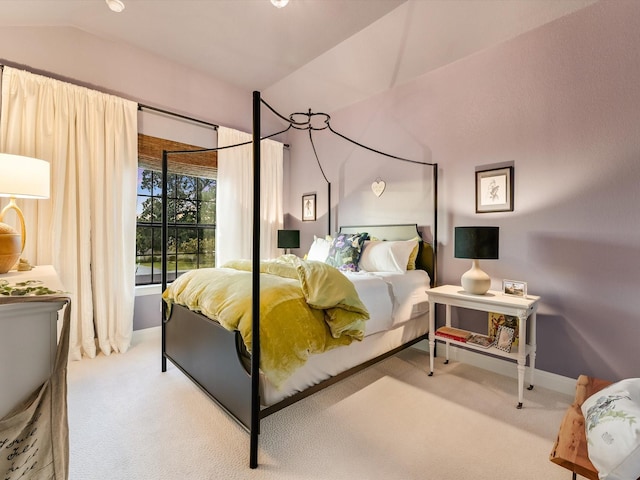 carpeted bedroom with vaulted ceiling