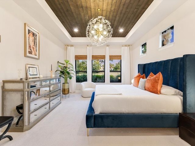 bedroom with a notable chandelier, carpet, wooden ceiling, and a tray ceiling