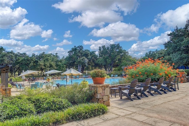 view of patio / terrace featuring a community pool