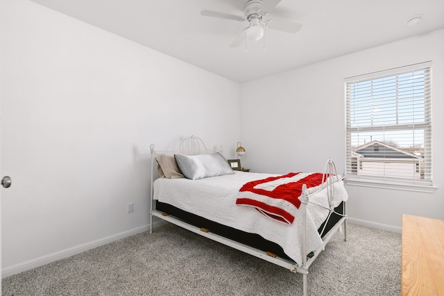 bedroom with carpet, a ceiling fan, and baseboards