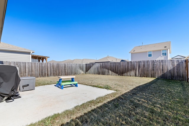 view of yard with a fenced backyard and a patio