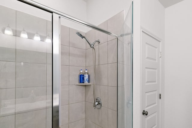 bathroom with a shower stall