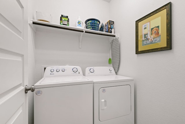 laundry area with laundry area and washer and clothes dryer