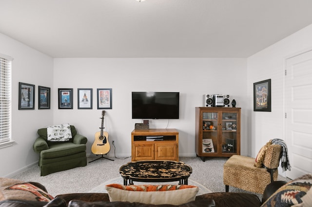 living room with carpet and baseboards