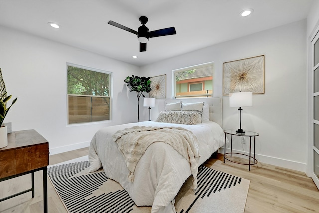 bedroom featuring ceiling fan and light hardwood / wood-style flooring