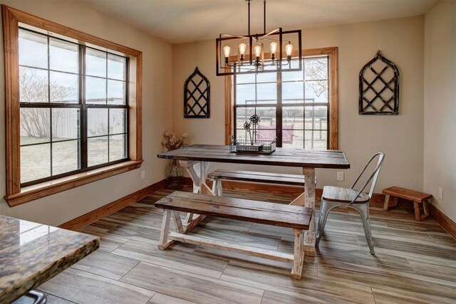 dining room featuring a notable chandelier and plenty of natural light