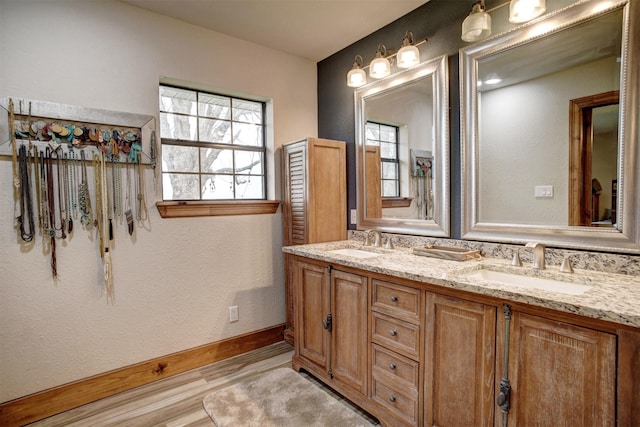 bathroom with vanity and hardwood / wood-style flooring