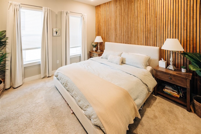 bedroom featuring light colored carpet