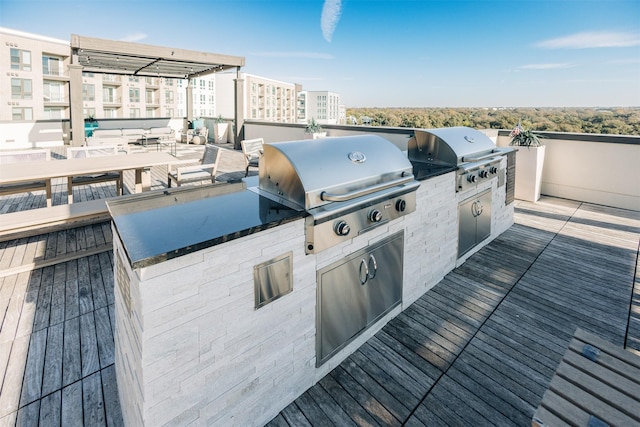 deck with exterior kitchen and grilling area