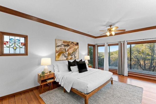 112 Center Cove Iii Loop, Spicewood, TX 78669 - bedroom featuring access to exterior, multiple windows, wood-type flooring, ornamental molding, and a ceiling fan