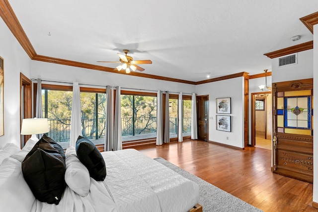 bedroom with ceiling fan, hardwood / wood-style floors, crown molding, and access to outside