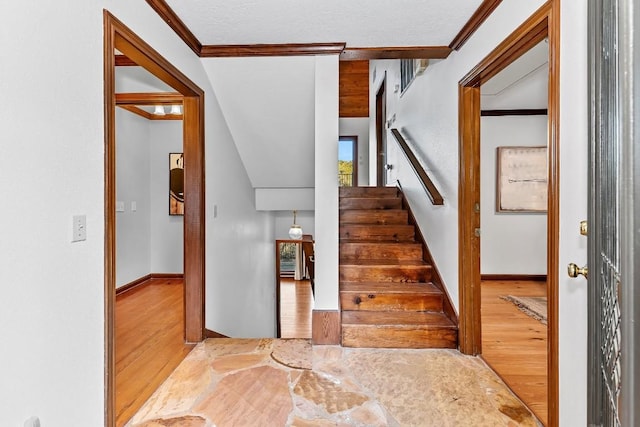 112 Center Cove Iii Loop, Spicewood, TX 78669 - stairs featuring wood finished floors and ornamental molding
