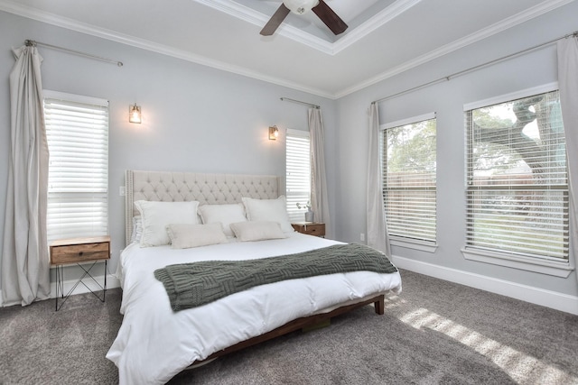 bedroom featuring ceiling fan, carpet, a raised ceiling, and crown molding