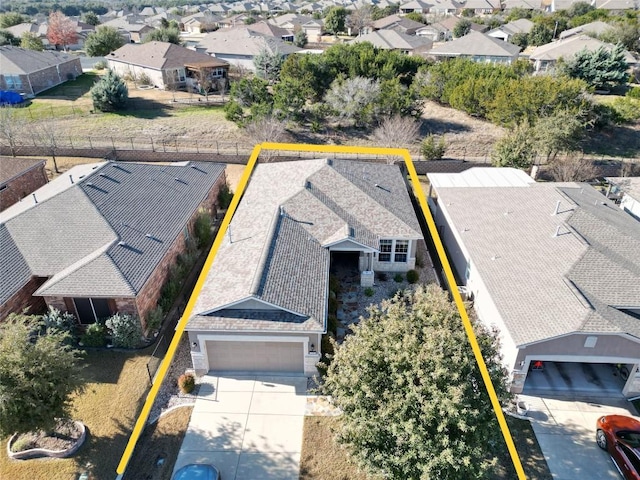 birds eye view of property with a residential view