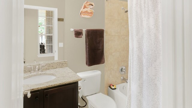 full bath featuring toilet, shower / tub combo, and vanity