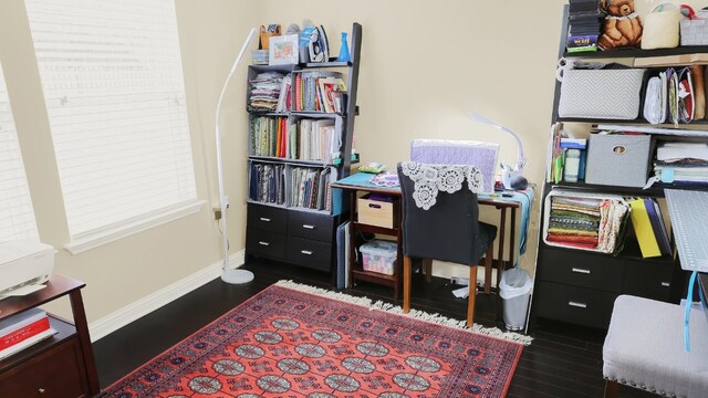 home office with wood finished floors and baseboards